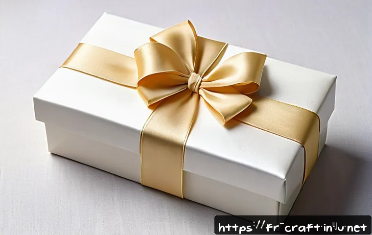 수공예 리본 공예 - A beautifully wrapped wedding gift featuring elegant satin and silk ribbons in soft ivory and pastel...